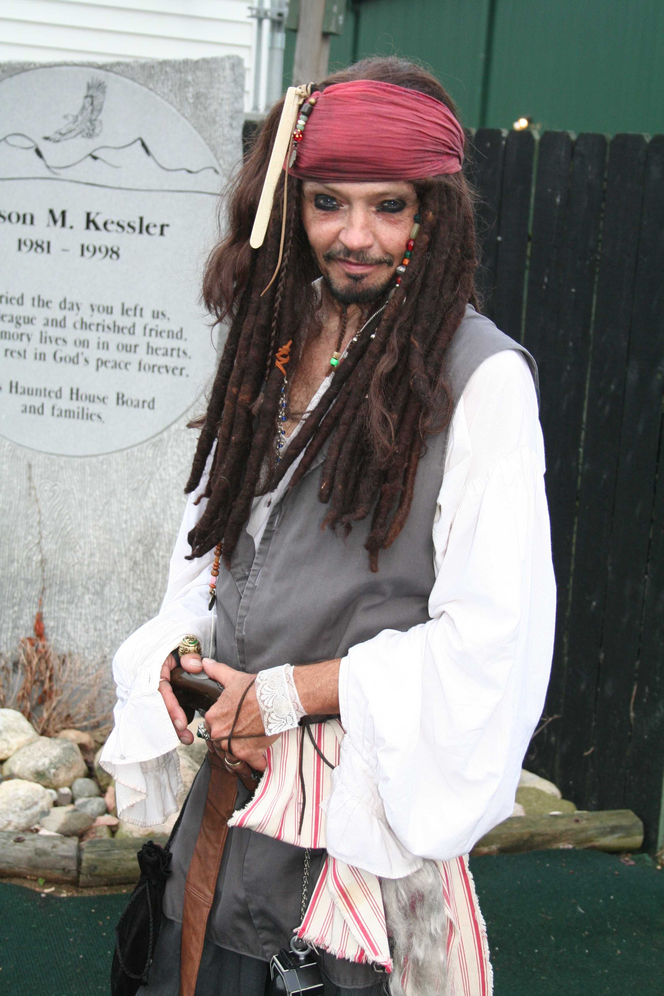 Captain Jack Sparrow, played by Dennis Davis, poses for a moment between entertaining haunt's guests.  Preface photo/ KELSIE FERGUSON