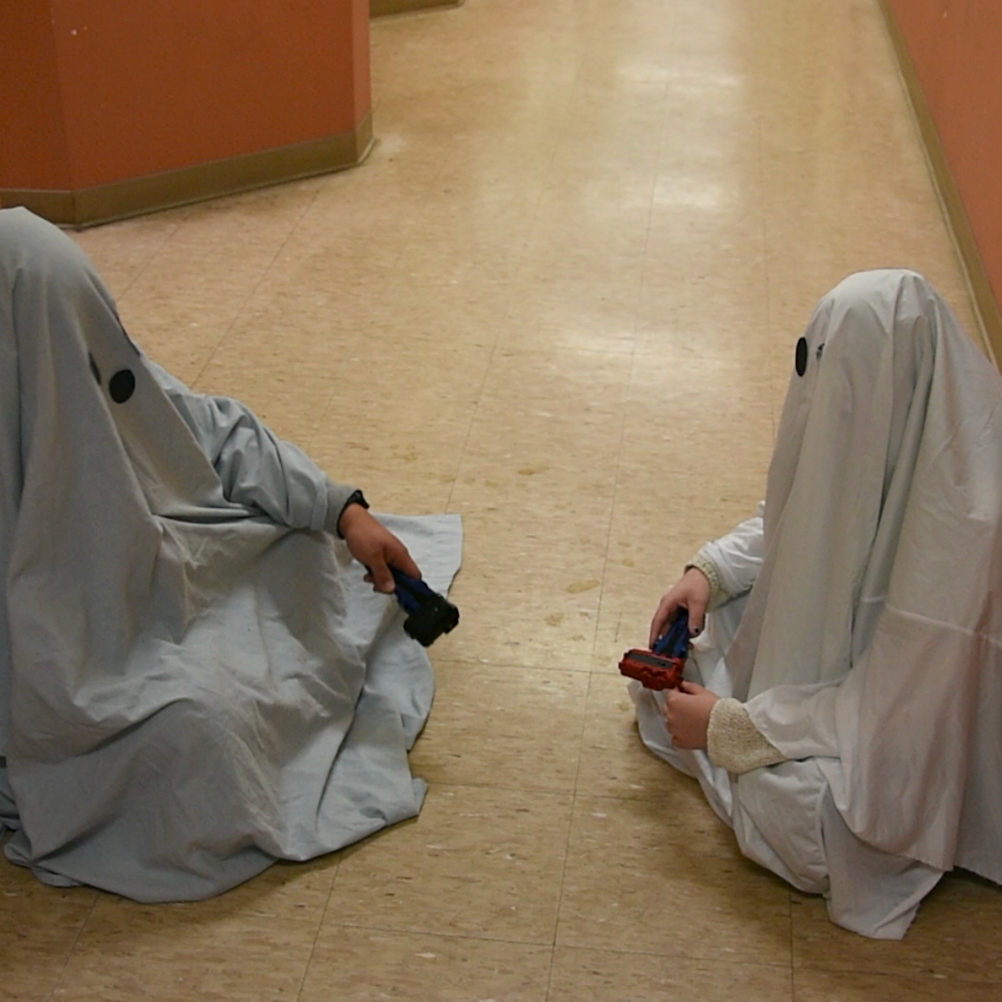 Photo // Cienna King - 
THESE PHANTOMS ARE FREAKY. Ghost Rafi and Ghost Cienna play Beyblades in the Scooby-Doo hallway.

