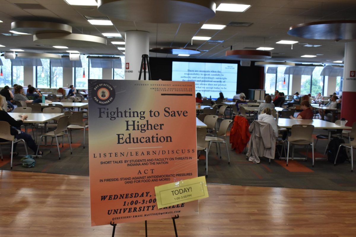Photo // Mira Costello - 
LISTEN, LEARN, DISCUSS, ACT. Professor Andrew Swain delivers his talk, “When Authority Conflicts with Principle,” at the second Day of Action for Higher Ed on April 15. 
