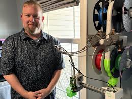Photo // South Bend Tribune - 
MANUFACTURED LOVE. Marvin is ready to start printing models for children in need. 
